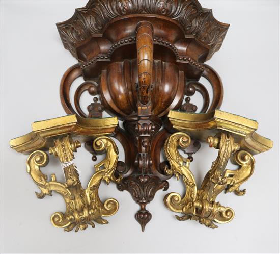 A pair of giltwood wall brackets and a walnut wall bracket